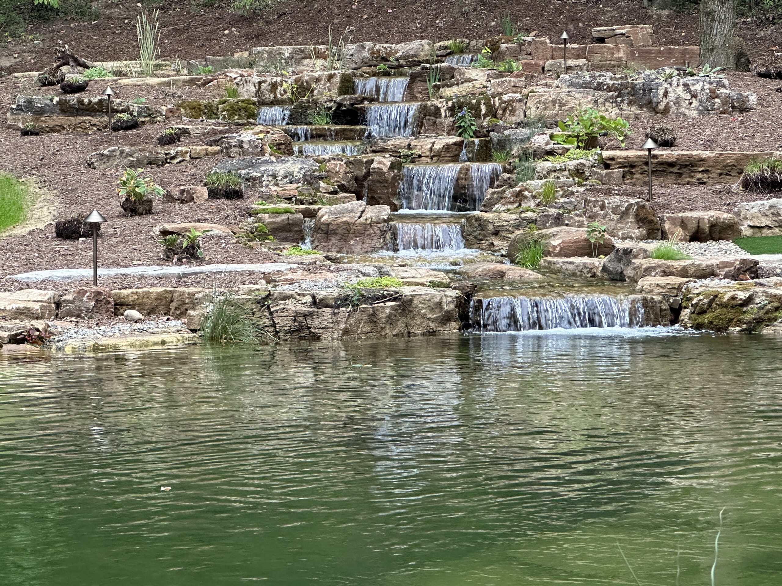 backyard pond waterfall oasis | Platinum Ponds & Landscaping