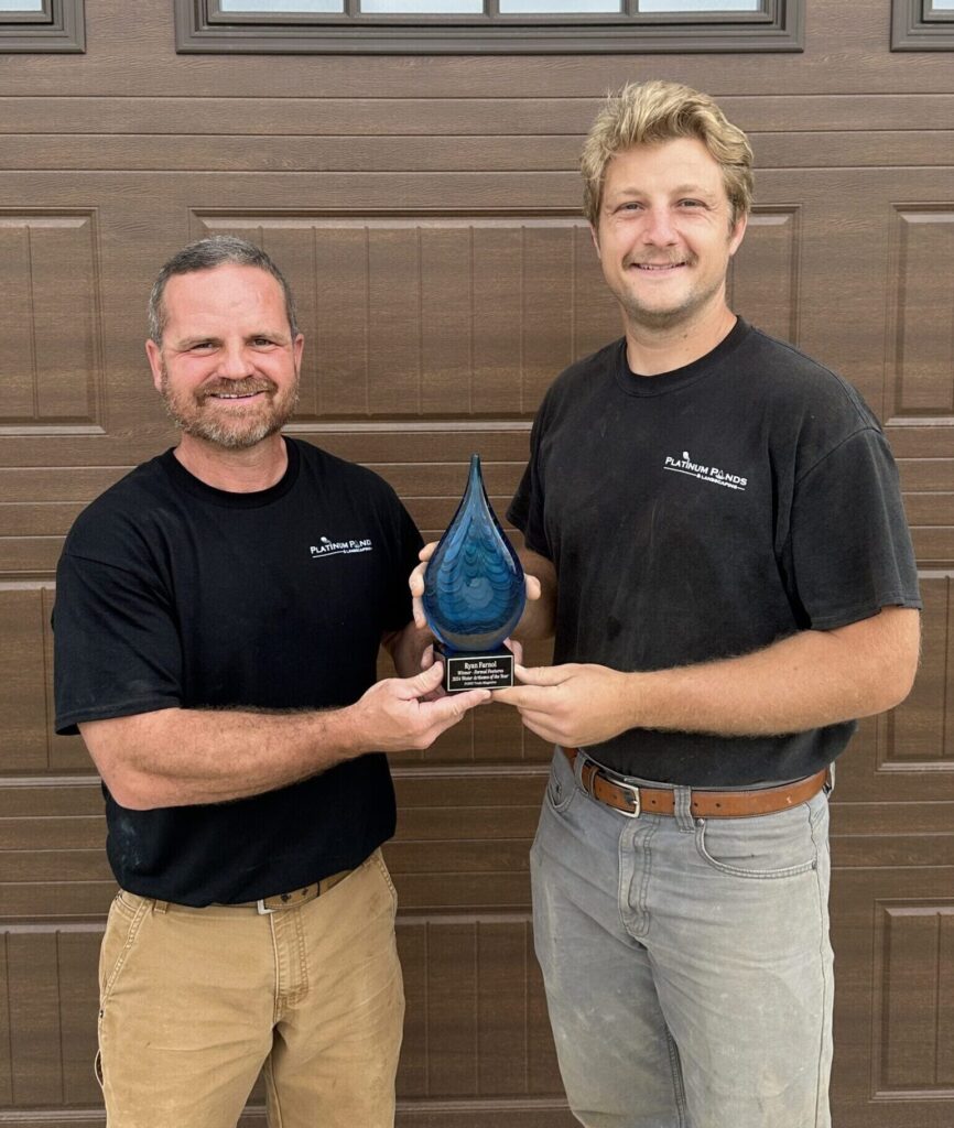 Holding the award