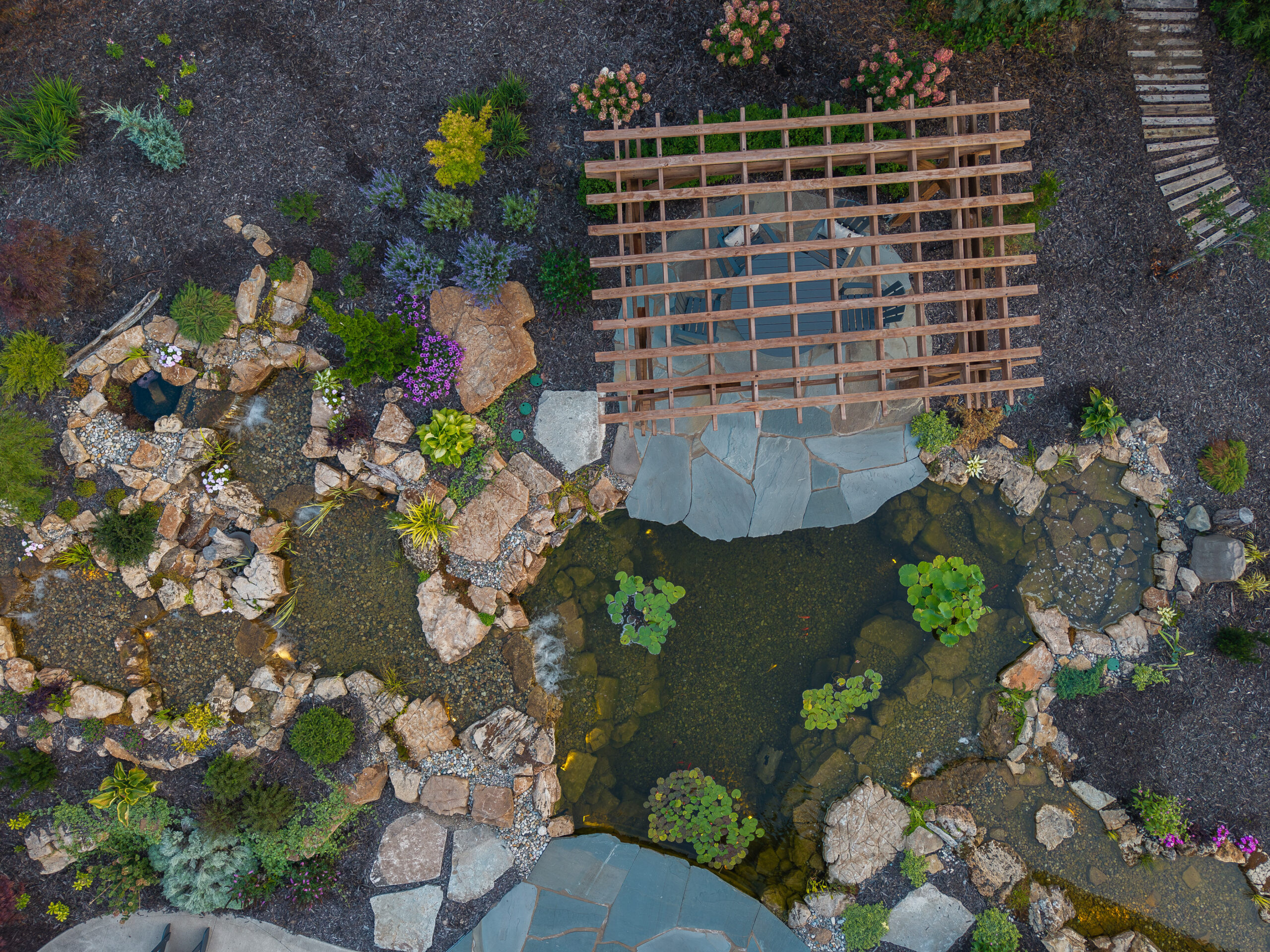 ecosystem koi pond, multiple streams, wetland filter, aquatic lighting, flagstone patio, flagstone walkway, natural stone steps