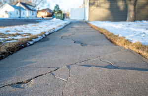 How michigan’s freeze–thaw cycle impacts patios, ponds, and retaining walls 1 Cracked and heaving walkway